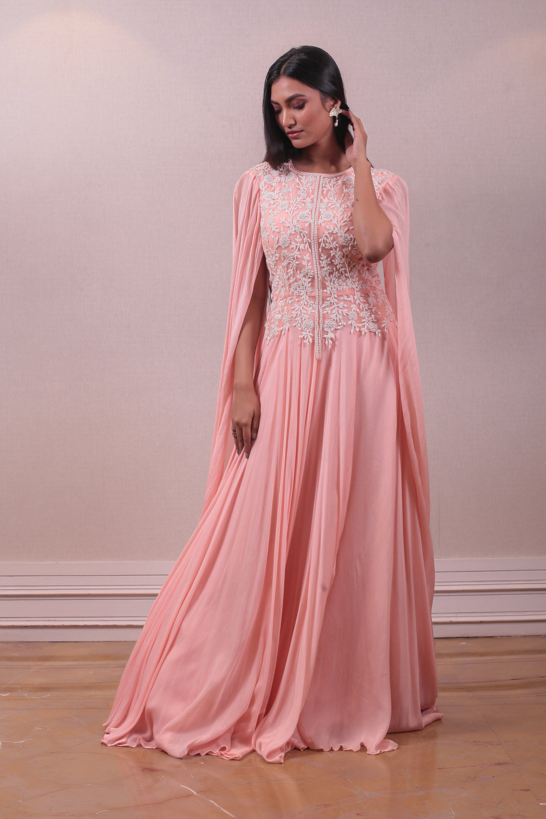 Designer Peach Cape Gown with Modern Silhouettes