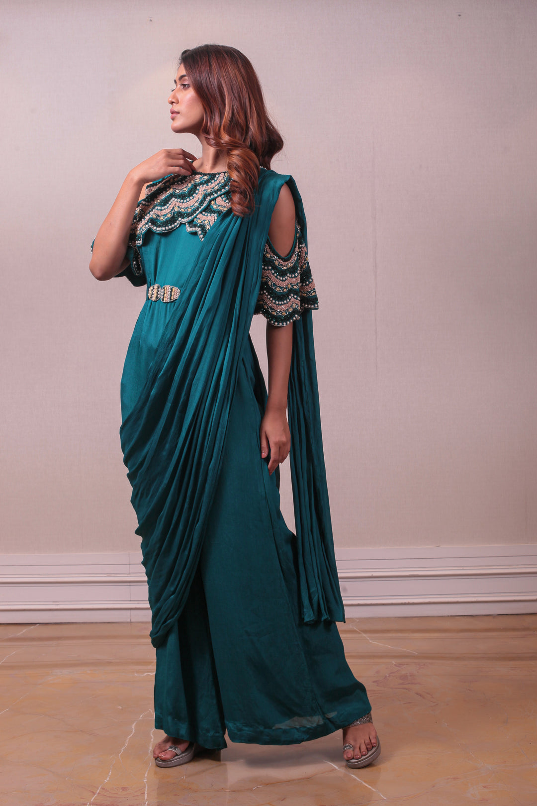 Designer Teal Embellished Crepe Silk Drape saree